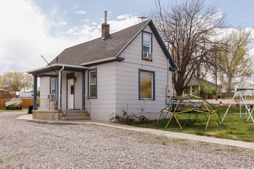 Updated & move-in ready! This 4 bed, 1 bath home sits on .32 acre corner lot and features a new roof and new rooftop A/C. Enjoy plenty of parking for RV'S, trailers, and all your toys, plus a sprinkler system to keep the yard looking great.  Buyer is advised to obtain an independent measurement.