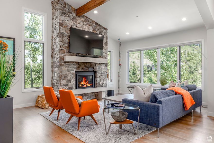 158 Ridge Ave is an exceptional opportunity in one of the most unique Old Town neighborhoods. This mountain transitional home offers an upbeat and contemporary option for those seeking the charm and convenience of owning in Old Town. Walking or biking directly from the home and accessing the many aspects of Main Street is an added benefit. The cascading floor plan begins at the garage level and entry to the light filled stairs leading to the open and spacious living areas. For convenience a 3-level elevator is present. You will love coming home to this relaxed, private, and inviting year-round home. Kick your feet up in the great room that flows easily into the kitchen and dining areas and out to one of the two heated decks with expansive views. The main living level is complete with a luxurious bath and guest bedroom. The full walk-out lower level is a delightful surprise, offering a second family room or flexible space to suit your needs. Perhaps a possible yoga room or gym, family room, playroom, or extra sleeping area? Here you'll also find access to another heated deck with an open air stargazing hot tub and a covered sitting area furnished with a gas table top firepit. The primary suite features a cozy fireplace, private and beautiful full bathroom. A third bedroom and bathroom are conveniently located on this level, along with the washer/dryer. Additional highlights include a one-car garage, radiant heat, plus forced heat and air conditioning. Three interior gas fireplaces plus the table top firepit bring seasonal warmth all through the indoors and outdoors. All finishes are completed beautifully and feel like new! Three homes share the private, heated common driveway to their individual driveways. The current $2400 HOA dues are for the heating of the shared driveway. This home also individually heats its driveway and front walkway in a separate billing. No shoveling necessary! Per Park City Municipal this is short term rental home eligible, which provides a flexible owner use. Furniture remains with the home.