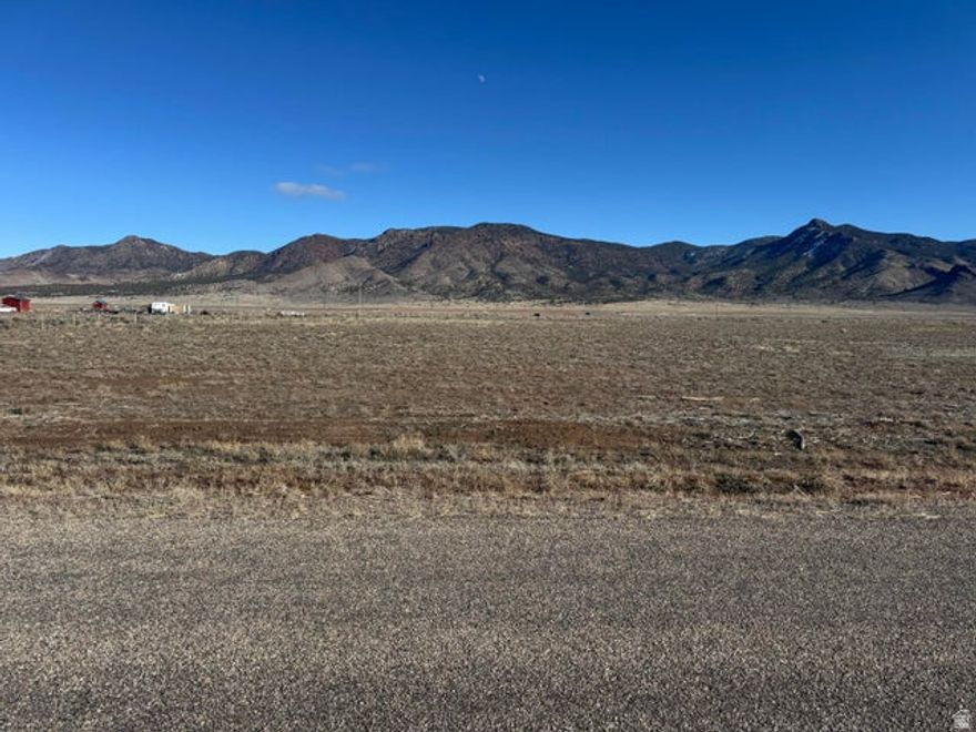 Fantastic 5ac lot available in the Broken Spur subdivision in Newcastle Utah. Right at the base of the Antelope Mountains. Paved road to the property for year round easy access. New water well installed in 2025. Pump will be installed before closing. Dixie Power line along East property line. Half acre foot of water right #71-5992 is included in the sale. Water right approved through a change application by the state in September 2025. Beautiful mountain and valley views. Build your dream home, 2nd home, or have a vacation retreat property to spend time w/ friends and family. Bring your RV, trailers, toys for getaways. Only 15 minutes to Newcastle Reservoir for boating and fishing. 50 Minutes to Cedar City or St. George. 20 min to Enterprise for Food/Amenities.