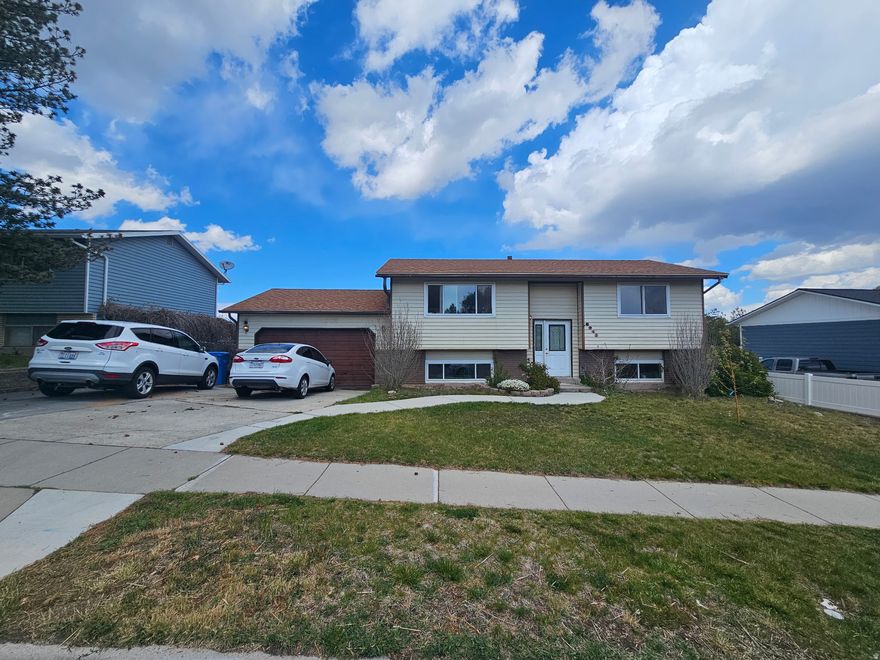 Split-entry home located on a quiet road in Kearns with valley views and great potential for the next owner. This property features quartz countertops, updated finishes in key areas, and a functional layout designed for everyday living. The partial ADU offers added flexibility for extended family, guests, rental potential, or a private home office setup. Major system upgrades have already been completed, including a brand new roof, furnace, water heater, central air, new plumbing, and a brand new backyard deck. The large backyard offers plenty of space for entertaining and outdoor use, complete with an included swim spa.  Square footage figures are provided as a courtesy estimate only and were obtained from county records.  Buyer is advised to obtain an independent measurement.