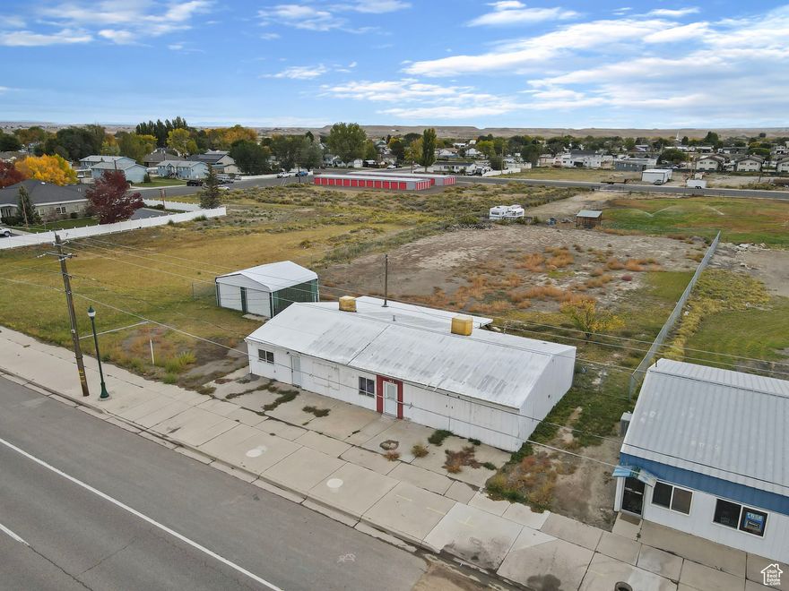 LIVE, WORK, & PLAY IN THE HEART OF HUNTINGTON! Discover a rare opportunity to own a versatile commercial property on Main Street featuring two separate units, one originally designed as an apartment, ideal for live/work flexibility or additional rental income.  Located just minutes from Huntington Reservoir and surrounded by some of Utah's best outdoor recreation, this property offers the perfect balance of business potential and small-town living. Imagine running your business and living on-site, all for less than the cost of city living.  The extra-large, fully fenced yard provides plenty of space for equipment, vehicles, or future expansion, and the two-car steel garage (with a dividing wall) can serve as separate storage units, workshops, or rental spaces for additional revenue.  Recent updates include new electrical panels and setup for three separate meters, offering flexibility to expand or add another tenant in the future. While the property could benefit from some cosmetic improvements, it's move-in ready and can be enhanced over time.  Whether you're an investor or an owner-occupant seeking flexibility and value, this property delivers outstanding potential. Just 15 minutes to Price and about an hour to Utah County, this is small-town commercial real estate with big opportunity.  Additional land available. Owner/Agent. Call today to schedule your private showing!