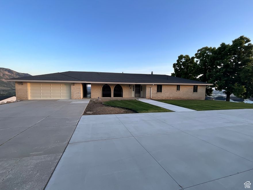 Pride of ownership shows in this immaculately kept one owner home. Huge covered deck and patio with breathtaking views of the mountains and the valley. Tons of parking along with four car garage. Open floor plan with two full kitchens, 4 bedrooms and 4 bathrooms. Easy to show. Come see it today!