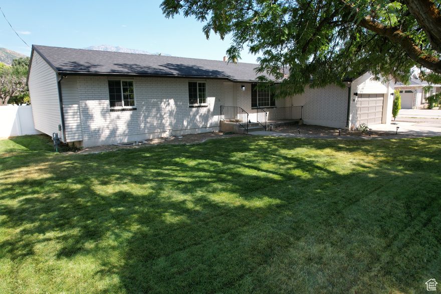 Reduced Price!  The arial pictures show how amazing this location is! Click TOUR to see the 3D virtual tour inside! Large .46 acre lot with animal rights!  For animal rights see Lindon city code 6.32.10 https://lindon.municipal.codes/Code/6.32.010      ---5 bedroom 3 bath Rambler open layout.  Office and formal living room. Updated kitchen and bathrooms. Basement all new in 2025. New roof shingles 2025. Quarts countertops, tile backsplash, fresh paint and more. Attached 2 car garage plus a 32x22 detached shop with power and gas. Large storage above shop accessible by outside stairs.  Plenty of RV/equipment parking behind the back yard fence. Beautiful views from back yard. Evening shade from west facing home. Fruit trees, garden area, composite deck.  Move in ready, come and see!