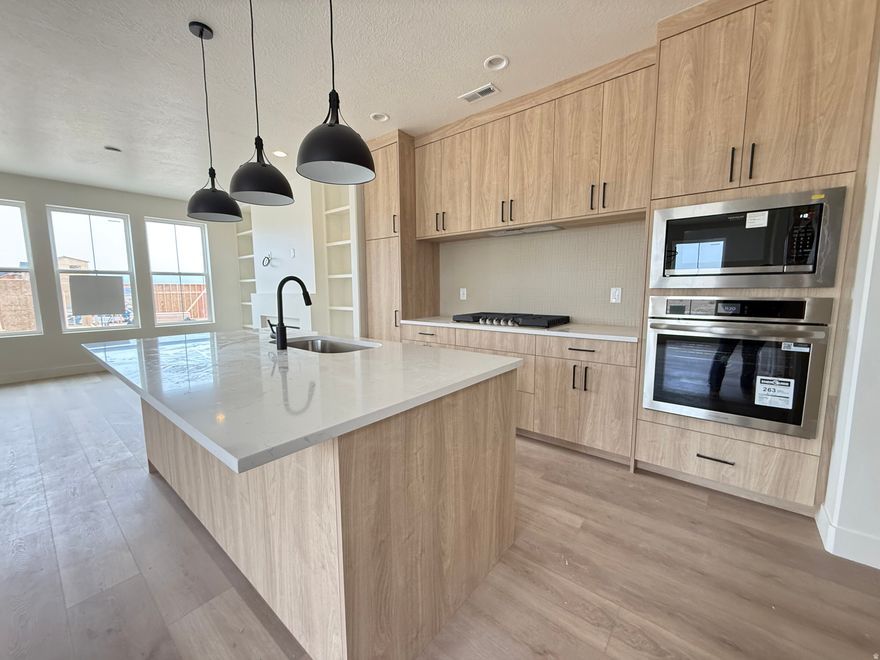 Step into the Wildwood floorplan living at its finest! This gorgeous corner-lot home features a chef-inspired kitchen with spacious counter space! Lofty 9-ft ceilings on all levels the primary suite stuns with a vaulted ceiling and your own private balcony-perfect for morning coffee or sunset unwinding! With warm wood cabinetry, sleek quartz counters, and access to open land and miles of trails, this home blends luxury with nature in all the best ways.   ****June Completion****