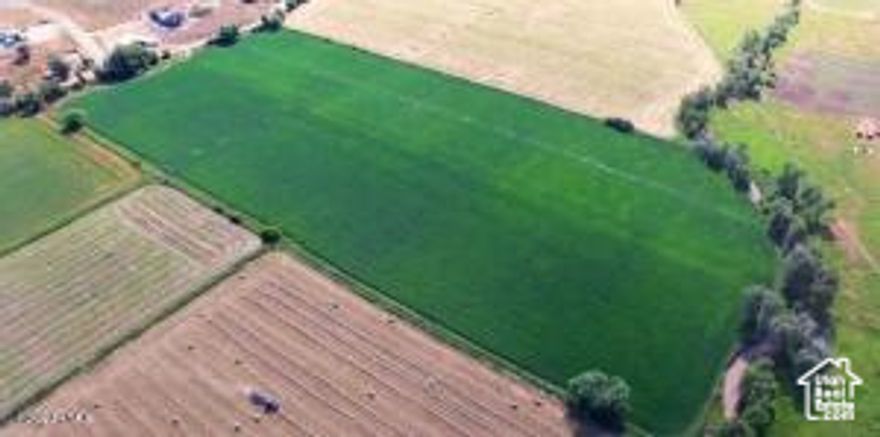 A Rare Wallsburg Offering with Sweeping Scenic Views. Discover the freedom of country living on this nearly 25-acre property set against Wallsburg's breathtaking mountain backdrop. Perfectly positioned for privacy and serenity, this land combines panoramic vistas with convenient proximity to surrounding communities. Comprising three parcels (Parcel #0000103627, #0000103288, and #000069117), the property is currently farmed and includes 19 Main Creek Irrigation water shares-providing exceptional agricultural versatility. One parcel is a -acre lot of record, offering unique development opportunities or added flexibility for future use. An ideal canvas for a ranch, homestead, or agricultural venture, this property invites you to create something extraordinary. Listing agent is related to the owner. Buyer to verify all information. Acreage figures are provided as a courtesy estimate only; buyer is encouraged to obtain an independent survey for accuracy.