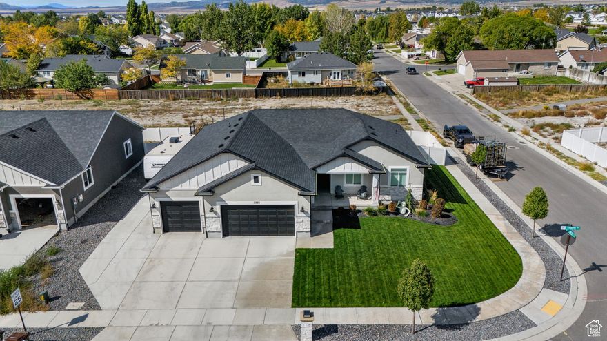 Welcome to this stunning, meticulously maintained 6-bedroom, 3-bathroom luxury rambler located in one of Eagle Mountain's most desirable neighborhoods. Built in 2021, this 3,226 sq. ft. home blends timeless design with modern upgrades, all set on a beautifully landscaped .19-acre lot. Step inside to discover an open-concept floor plan featuring crown molding, granite kitchen countertops, and elegant LEAD lighting throughout. The gourmet kitchen flows seamlessly into the family room, centered around a striking natural stone fireplace and a cozy bay window, perfect for relaxed living and entertaining. The primary suite is a private haven, offering French doors, a luxurious separate tub and shower, and a spacious walk-in closet. Each bathroom is thoughtfully equipped with humidity sensors for enhanced comfort and efficiency. Downstairs, the fully finished basement includes a separate entrance, making it ideal for a guest suite, rental potential, or multi-generational living. The highlight? A state-of-the-art theater room complete with premium surround sound, creating the ultimate movie-night experience. One of the true highlights of this home is the custom built theater room, designed to feel like a private cinema. Every detail was carefully planned to make it a complete movie experience at home.   Luxury carpet chosen specifically for comfort and elegance  Double 5/8 inch drywall with extensive insulation, making the room soundproof   Modern recessed lighting and stylish wall sconces with perfect dimming for movies   Matte paint to prevent glare from the projector   Acoustic wall panels that eliminate echo and create an acoustic quality environment   120 inch screen, 10 feet wide by 5 feet tall, for an impressive viewing experience   LG Laser Beam 4K projector included   Surround sound system with 360 degree premium speakers included  Prewired closet for connecting a computer, gaming system, or any device directly to the projector   Custom built bar area with space for a mini fridge and microwave, perfect for drinks and popcorn  This theater is not just a room, it's a fully immersive experience built for comfort, performance, and entertainment at the highest level.  Some of the additional features you will love include:    Sunlit formal office  Oversized three car insulated garage with an extra deep bay   RV parking pad   Fully fenced and beautifully maintained yard front and back   Stunning exterior lighting at night   Walk in closets in multiple bedrooms   Trampoline included for family fun  Located on a quiet street near parks, schools, and scenic walking trails, this home blends lifestyle, comfort, and convenience in every detail.  3881 Chapman Way is more than a house, it's a place designed for the way you want to live. Don't wait too long to see it, this Eagle Mountain gem is a rare find and won't last.