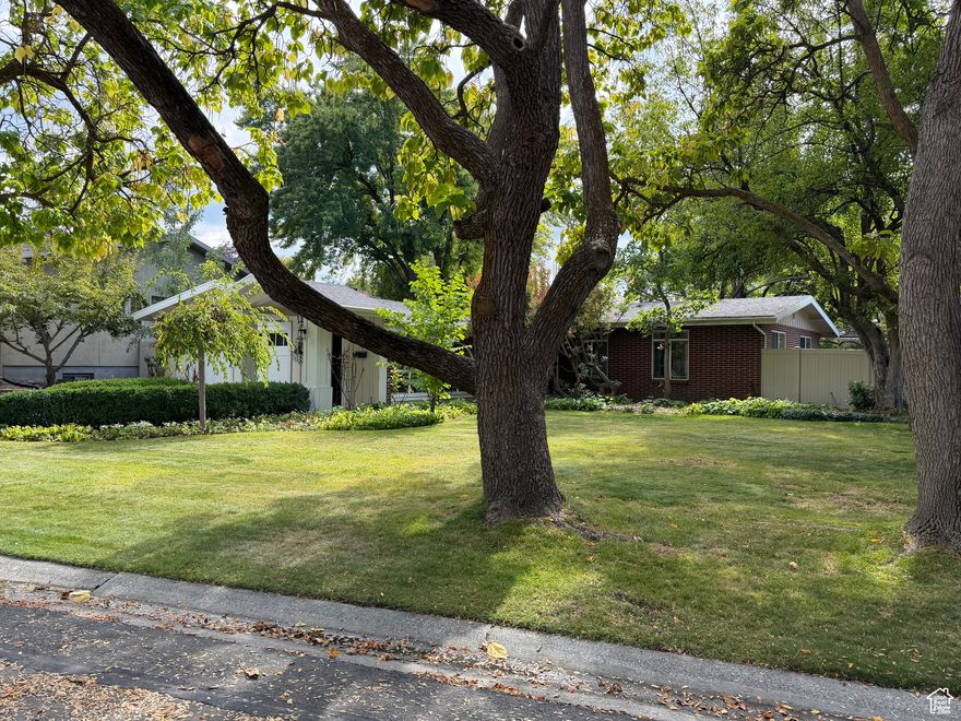 Welcome to this absolutely beautiful home with park-like setting and mature landscaping nestled in the heart of Holladay in one of its coziest neighborhoods. This extremely well maintained single-level home offers endless possibilities. Three bedrooms, an oversized open living room, large kitchen with dining area featuring viking appliances provides plenty of room for family gathering and entertainment. All new paint throughout, new drive-way, and new water heater and softener. New cabinets in bathrooms. Marble floors and granite countertops. Original wood floors throughout. This is a hidden gem around the corner from the upscale mixed residential/commercial development on the old "Cottonwood Mall" site featuring a new Trader Joe's store and gorgeous penthouse condomium living. Hurray, this won't last.