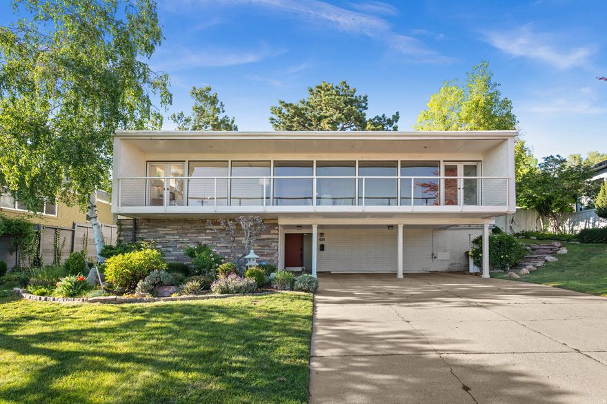 Built in 1957, this true midcentury home has stood the test of time. Its enduring appeal is rooted in simple, elegant design, making it a beautiful example of the architecture of its era. Owned by the same family for the past 35 years, the property is ready for its next chapter. Set back on the lot, the home captures sweeping views from the Wasatch Front to the western horizon, stretching endlessly beyond. All square footage is above grade, with living spaces thoughtfully elevated to maximize both views and privacy. On warm days, retreat to the lush, private back patio, where cool breezes and the shade of mature trees create a peaceful escape. Easy to see with an appointment- contact listing agent and use Align