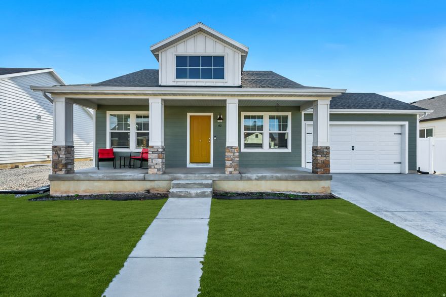 Welcome home to this well-appointed Santaquin residence offering the perfect balance of modern design and everyday comfort. The open-concept main level features 3 spacious bedrooms and 2 bathrooms, creating a functional and inviting layout. At the center of the home is a stunning kitchen with granite countertops, a large island, and plenty of space for hosting and daily living. Vaulted ceilings elevate the main living area, while the electric fireplace adds a cozy focal point.  The unfinished basement presents unlimited potential for future expansion, allowing you to tailor the space to your lifestyle. Step outside to a fully fenced, beautifully landscaped yard with a generous patio ideal for entertaining, summer barbecues, or quiet evenings at home. A covered front porch adds charm and curb appeal, making this home as welcoming on the outside as it is inside. Located in a desirable Santaquin neighborhood, this home is a must-see.