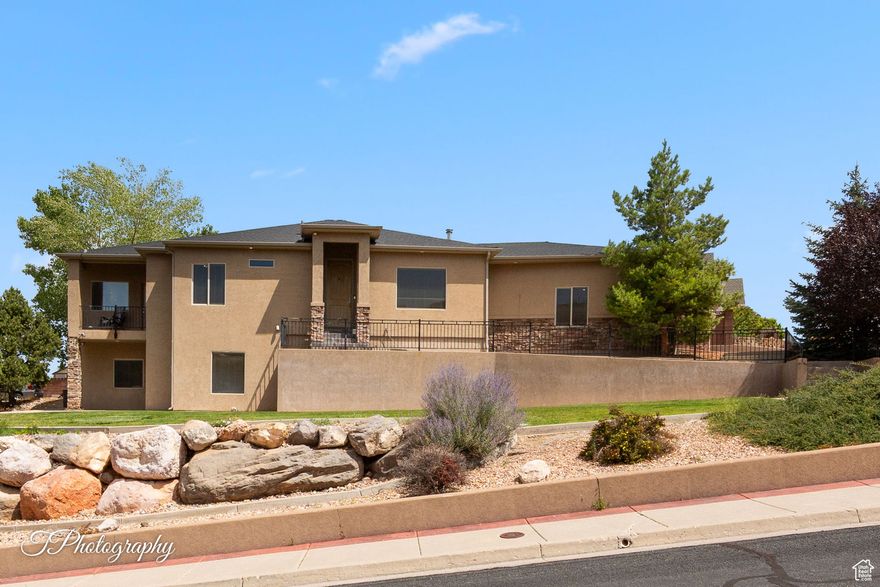 Welcome to this spacious Cedar City home, offering the perfect combination of comfort and flexibility. Situated on a large lot, this property provides plenty of outdoor space to enjoy the beautiful Southern Utah scenery. Inside, you'll find two family rooms and two fireplaces, creating warm, inviting spaces to gather and entertain. A unique highlight is the separate living area with its own kitchenette and private entrance-perfect for guests, extended family, or rental potential. With its generous layout, versatile floor plan, and expansive yard, this property offers endless opportunities-whether you're looking to create your dream outdoor retreat, host friends and family, or enjoy the benefits of a flexible multi-use home in a convenient Cedar City location.