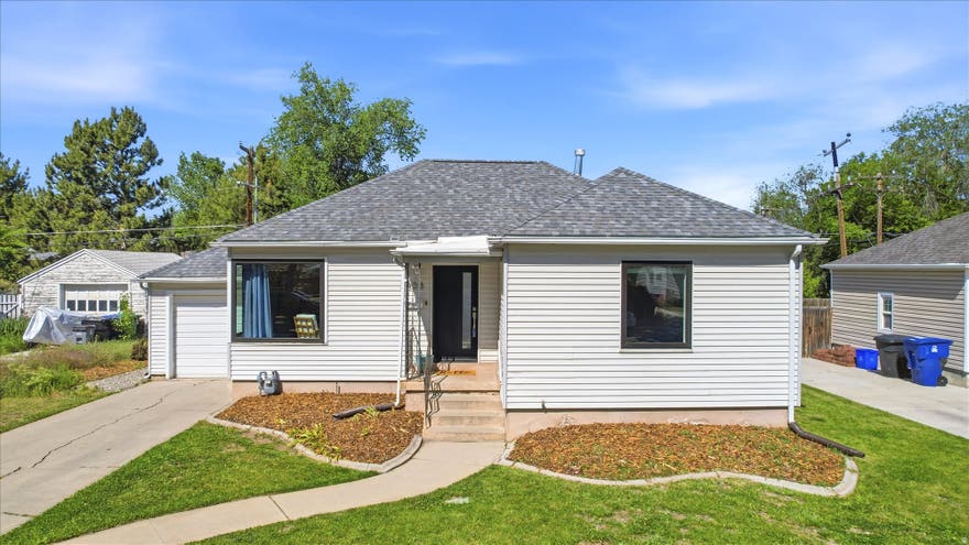 This charming bungalow blends thoughtful upgrades, modern style, and an unbeatable location with quick access to I-80, I-15, and I-215 for easy commuting throughout the valley. Inside, you'll find neutral three-tone paint, spacious bedrooms, and a clean, move-in ready interior filled with custom touches and a full appliance package included. The beautifully updated kitchen features custom built-ins, a charming custom dining nook bench, stainless steel appliances, recessed lighting, and upgraded finishes throughout. Additional improvements include highly upgraded new windows, tile shower surrounds, and a custom barn door addition that adds warmth and character to the home. Outside, enjoy a covered concrete patio, low-maintenance astro turf, included storage shed, new fencing, mature landscaping, and great curb appeal, all complemented by a one-car garage and a newer roof.