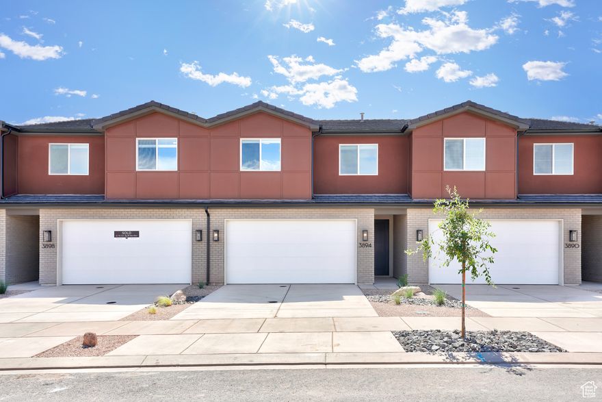 Step into the Horizon, where contemporary design meets refined comfort. This spacious 2-story interior townhome offers 1,650 square feet of living space, featuring 3 bedrooms and 2.5 bathrooms. Though an interior unit, it feels anything but enclosed, with ample natural light filling the open-concept layout. Perfect for relaxation or lively gatherings, the living spaces are thoughtfully designed to accommodate your lifestyle. The primary suite includes dual vanities, adding both functionality and style. With a 2-car garage and premium finishes throughout, Horizon provides a sophisticated and inviting lifestyle in the desirable Coral Canyon community.