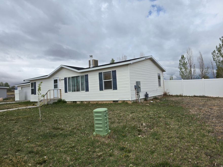 This charming single-family rambler in Vernal offers comfortable single-level living on a spacious 0.23-acre lot. With 1,293 sq ft, this home provides a functional layout with plenty of potential for both homeowners and investors. Enjoy the benefits of a generous yard with room for outdoor entertaining, gardening, or future improvements. Conveniently located near local amenities, schools, and recreation, this property offers small-town charm with easy access to everything Vernal has to offer. A great opportunity for a primary residence, rental, or investment property.  3% Seller concessions with preferred lender, 2% with other lenders or 2% can be used towards a purchase price reduction.