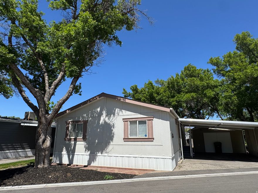 Updated, new paint, brand new roof, with the only garage /  and 220 V workshop in the park.  3 bedroom 2 bath on corner lot with full landscaping. Updated kitchen  One of a kind  with 2nd shed makes this live large!