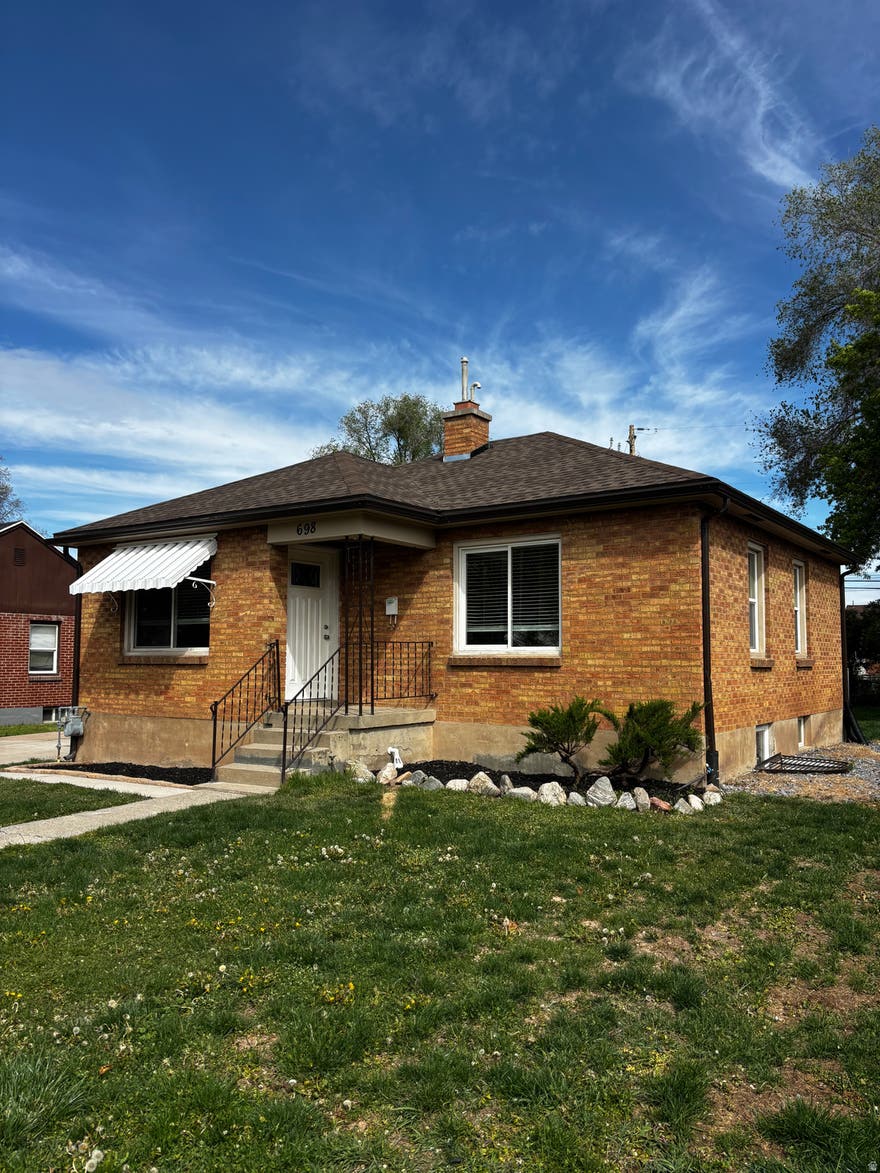 Darling Brick Bungalow has recently been updated and ready for a new family. Large yard with firepit, patio, and shed.