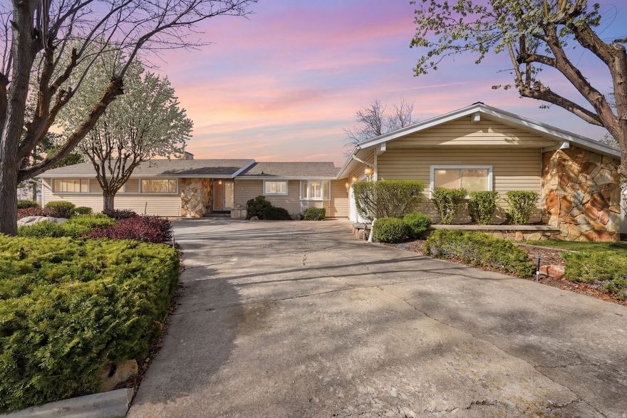 Just a chip shot from Birch Creek Golf Course, this beautifully maintained home sits on 1.19 acres of meticulously landscaped grounds and is ready for its next owner. The spacious main-level living area offers an inviting layout and walks out to a large covered patio-perfect for relaxing or entertaining. Featuring a separate basement entrance with generously sized rooms, providing excellent potential to create your ideal space. A large half-circle driveway ensures ample parking for guests and convenience. Don't miss out on this opportunity to own a well-cared-for property in a highly desirable location, combining lifestyle, flexibility, and timeless appeal. Square footage provided as a courtesy, buyers and buyer's agent to verify all information.