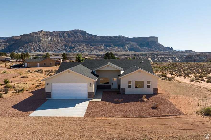 Welcome to your brand new desert retreat! This stunning 4-bedroom, 3-bathroom home, built in 2022, has never been lived in and offers modern comfort in the heart of breathtaking Big Water, Utah. With a spacious, open-concept layout, high-end finishes, and an abundance of natural light, this home is perfect for full-time living, a vacation getaway, or an investment opportunity close to Lake Powell. Set on a generous lot with sweeping views of the surrounding mesas and red rock landscapes, this property offers peace, privacy, and proximity to outdoor adventure-including hiking, boating, and exploring nearby national parks. No HOA, and short-term rentals are allowed, giving you flexibility and freedom. Primary Bedroom has exterior door with option to lock out as a vacation rental. Seller is offering a $10k concession for closing costs, rate buy down or landscaping. Buyer to verify all.