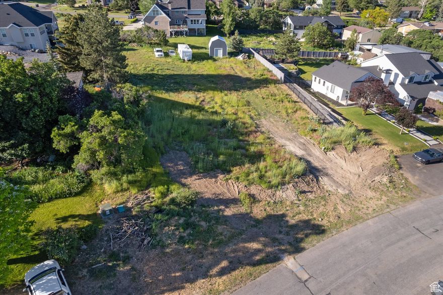 Rare Elk Ridge Upper Lot  Panoramic Views & Endless Possibilities  Start the new season-and possibly the new year-with the chance to build your dream home on one of Elk Ridge's most coveted upper lots. This expansive .46-acre homesite sits high above the valley, capturing unmatched views of Loafer Mountain, Utah Lake, and the entire Utah Valley. It's the ideal setting for a custom retreat, whether you envision a sleek modern design or a timeless mountain estate perfect for hosting holiday gatherings, summer evenings, and everything in between.  All utilities are stubbed to the lot (including sewer), and 1.4 acre-feet of water rights are included, giving you the rare opportunity to start building immediately. Preferred builders are standing by and ready to help bring your vision to life. A custom two-story shed already on site offers instant storage or workspace as your plans take shape.  Outdoor adventure begins right outside your door with nearby BLM land for hiking, biking, and exploring. You'll also enjoy quick access to Elk Ridge Park, schools, shopping, and the scenic Gladstan Golf Course-plus fast freeway access for an easy commute.  Privacy, serenity, and convenience come together in one extraordinary location. Opportunities like this are truly limited in Elk Ridge. Claim one of the community's finest upper lots and start designing the home you've been dreaming of-just in time for a fresh start to the year.