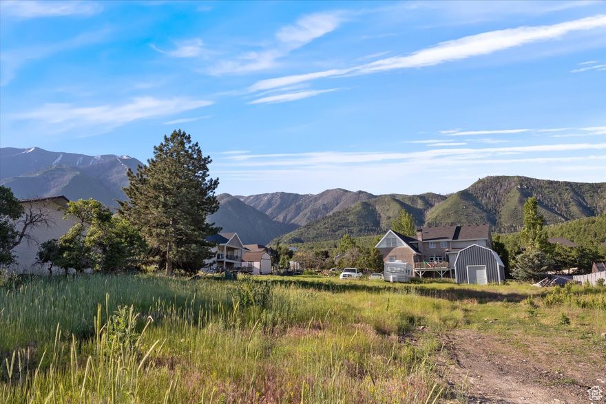 Rare Elk Ridge Upper Lot  Panoramic Views & Endless Possibilities. Welcome to one of Elk Ridge's most coveted addresses! This generous .46-acre homesite sits high above the valley, offering sweeping views of Loafer Mountain, Utah Lake, and the entire Utah Valley. Surrounded by beautiful custom homes and open space, it's the perfect canvas to design the retreat you've always imagined-whether a sleek contemporary escape or a timeless estate. With all utilities stubbed to the lot (including sewer) and 1.4 acre-feet of water rights included, you'll have everything you need to start building right away. A custom two-story shed is already on site, giving you instant storage or workshop space as your vision takes shape. Adventure is right outside your door with nearby BLM land for hiking, biking, and exploring. You'll also love the convenience of being close to Elk Ridge Park, schools, shopping, and a scenic golf course-not to mention quick freeway access that makes commuting easy. Privacy, serenity, and convenience all meet here. Opportunities like this rarely come available in Elk Ridge-don't miss your chance to claim one of the community's finest upper locations. Your dream build starts here.