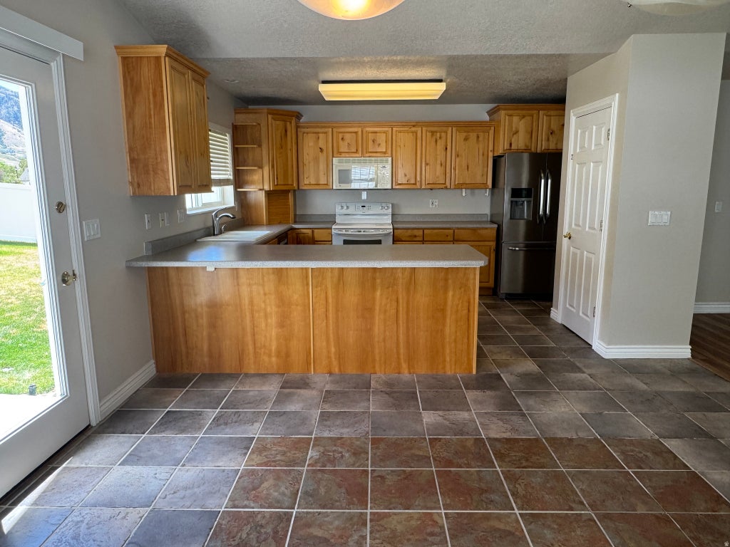 Photo of 88 CANTERBURY LN, Logan, UT 84321 (MLS # 2170150)
