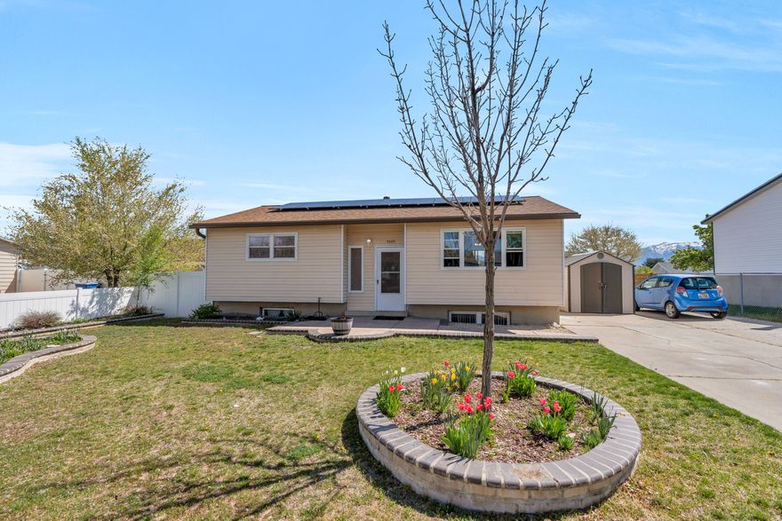 Welcome to this charming home in Kearns, Utah - with 1,880 sq ft of comfortable living space and  5 bedrooms, 2 bathrooms. Step inside and enjoy brand new carpet throughout the main level, giving the home a fresh, move-in ready feel. The layout is functional and spacious with plenty of room to spread out. Out back, you'll find one of the home's standout features - a beautifully stained deck with direct backyard access, perfect for entertaining or relaxing while taking in stunning, unobstructed views of the Wasatch Mountain Range. The fully fenced yard includes a full sprinkler system, two storage sheds, and a fun play area with slide and swings. Recent updates give buyers extra peace of mind:  a new water heater (2024), and a new dishwasher - plus solar already in place to keep utility costs down. All appliances are included!  Truly move-in ready. Location doesn't get much more convenient.  Just 5 minutes from Jordan Landing and Bangerter Highway, putting shopping, dining, and easy commuting all within reach. Great neighborhood, great views, and great value. Come see it before it's gone!