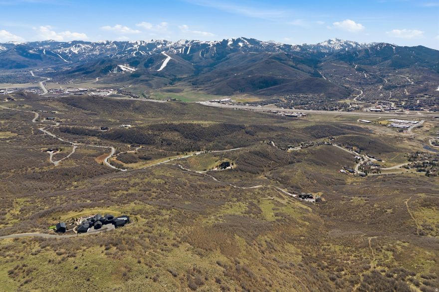 Set behind the gates of Ranches at the Preserve, this 25+ acre homesite captures the essence of Park City living with wide open space, complete privacy, and breathtaking unobstructed views stretching across Deer Valley, Park City Mountain, and Utah Olympic Park. Imagine designing your own mountain retreat with room to breathe. With a generous building envelope of up to 50,000 square feet, you have the freedom to create a primary residence tailored to your vision, along with a guest house, caretaker's cottage, and even a barn. Whether you envision a modern alpine escape, a legacy family compound, or an equestrian property, the possibilities here are extraordinary. Despite its peaceful, tucked-away setting, you are just minutes from the energy of Park City. Kimball Junction's dining, shopping, and everyday conveniences, including Whole Foods, are close at hand, while world class skiing at Deer Valley Resort and Park City Mountain is just a short drive away. Adding to the lifestyle, the property is adjacent to Glenwild Golf Club & Spa, Utah's top rated golf course, offering golf, tennis, pickleball, fitness, dining, and a vibrant social scene. Memberships are available separately. This is more than land. It is the opportunity to build your vision in one of Park City's most coveted private communities. Lot size source is county records, buyer to verify.