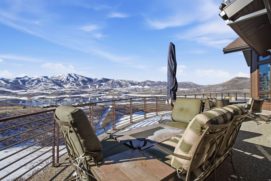 Nestled on a quiet cul-de-sac in Hideout, this rare find delivers mountain living that feels effortlessly luxurious and wonderfully livable. From the moment you walk up the heated paver-stone driveway, this home sets the tone with thoughtful design, smart upgrades, and spaces created for real life and real fun. Inside, gorgeous panoramic views of the Jordanelle Reservoir, Timpanogos and Deer Valley's East Village follow you from room to room. The main level features a bright, inviting great room with upgraded lighting throughout, a gourmet chef's kitchen with high-end Viking appliances and new built-in Sub-Zero refrigerator, plus automatic blinds that adjust at the touch of a button. Two oversized pantries, powder room and large laundry round out the common area. The grand primary suite on the main level is its own retreat with 2 spacious walk-in closets, and direct access to a walkout front patio.  Upstairs you will find a loft space perfect for an office, with private patio to enjoy the view and play hooky from work. A large finished flex space with full bath would be a perfect spot for a bunk room, craft room, sound-proof media lounge, music studio to suit your lifestyle. Entertainment is elevated on the lower level with a family/game room complete with wet bar, walkout to large private deck, and whole-home sound system. You will also find 3 guest bedrooms with ensuite baths, a second laundry room  and abundant storage. Lastly, there is an oversized two-car garage wired for an EV charger and a generator  to ensure everyday convenience. Outdoor living shines with an automatic awning equipped with a wind alert, perfect for relaxing while soaking in those majestic mountain views. And with Park City's Main Street, world-class ski resorts, and Salt Lake City International Airport all within easy reach, this home blends mountain serenity with unbeatable access. A rare mix of comfort, technology, style, and pure Utah scenery-welcome to a home that just feels right.