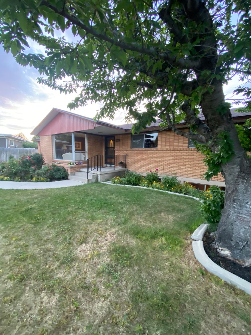 This wonderful home has been meticulously cared for by the original owner.  It features a generous living room, a large eat in kitchen and 3 bedrooms upstairs with lots of built-ins.  Downstairs you'll find a delightful wet bar, a cozy den with an eye-catching stone fireplace along with 2 more bedrooms.  There is new vinyl flooring throughout the kitchen, entry and bathrooms and new carpet in the upstairs bedrooms as well.  It has been recently painted inside and out and has a newer roof and HVAC system and water heater. The yard is filled with gorgeous perennials and fruit trees.  It's located in a lovely neighborhood where pride of ownership shows. This delightful and spotlessly clean home is a great example of a perfect mid-century classic just waiting for your updates to make it modern and fabulous!    Let your mid century vision come to life in this fantastic property and all that it has to offer! Come and see it today!