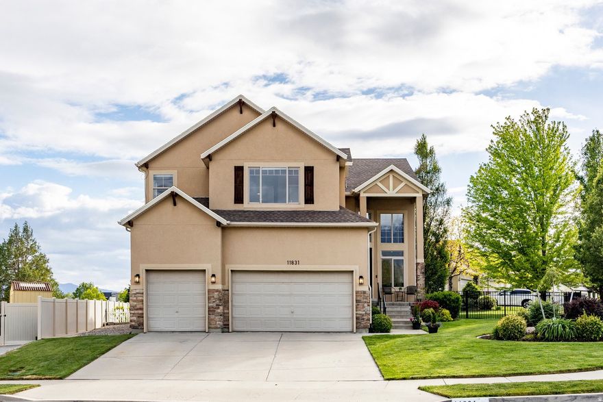 Welcome to this fantastic family home tucked away on a quiet cul-de-sac in the highly desirable city of Highland! Sitting on a large corner lot with beautiful mountain and Utah Lake views, this home has tons of space, natural light, and room for everyone to spread out.  You'll love the grand entry and formal living room with soaring two-story ceilings that make the home feel bright and open from the moment you walk in. The rest of the main level features 9-foot ceilings, a formal dining room, and a flexible den currently being used as a piano room. There's also a mudroom plumbed for a second main-level laundry room if you'd like that option.  The heart of the home is the spacious great room with the kitchen, breakfast nook, and cozy family room all connected together. The stone gas fireplace creates the perfect gathering space, while the kitchen features granite countertops, stainless steel appliances, gas range, and laminate flooring. Just off the kitchen is an enormous maintenance-free TimberTech deck with plenty of room for entertaining, BBQs, or simply enjoying the views. The fully fenced backyard is ideal for kids and pets.  Upstairs you'll find an extra-wide hallway open to the main level below, along with 4 bedrooms and 2 bathrooms. The oversized primary suite features vaulted ceilings, separate his-and-her closets, and a spacious bathroom with double sinks, separate tub and shower, plus a cosmetic vanity. One of the secondary bedrooms is extra large with vaulted ceilings as well. Every bedroom has amazing views of the mountains, Utah Lake, or both.  The basement has fresh paint and brand-new carpet and offers even more living space with a huge family room, 2 additional bedrooms, an updated full bathroom, and a large laundry room.  Additional highlights include new carpet throughout the entire home, a new roof replaced in 2023, tons of storage, a 3-car garage, RV parking, and an unbeatable location close to everything Highland has to offer. This is the kind of home your family can grow into and enjoy for years to come.