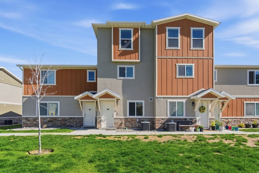 Located in the highly sought-after Tucker's Row community within Vineyard's premier Waters Edge master-planned development, this beautifully situated home offers the perfect blend of convenience, lifestyle, and community living. Just west of I-15 and only a short walk to the FrontRunner station, commuting throughout Utah County and Salt Lake County is effortless. Enjoy being less than 10 minutes from Utah Valley University, under 20 minutes to Brigham Young University, and minutes from shopping, dining, entertainment, and outdoor recreation including Megaplex Theatres at Geneva, Topgolf Salt Lake City, and the shoreline of Utah Lake. Residents enjoy access to an incredible amenities package including water, sewer, trash, high-speed internet, snow removal, landscaping, and access to multiple clubhouses. Waters Edge features over 400 acres stretching to Utah Lake with 78 acres of open space, scenic walking and biking trails, multiple parks, playgrounds, splash pads, athletic fields, sports courts, sandy beach access, pools, workout facilities, pavilions, and more. Enjoy a vibrant neighborhood atmosphere with Bella's Market just a short walk away and endless recreation right outside your door. This is Utah County living at its finest with unbeatable access to transit, universities, tech corridors, and outdoor adventure.