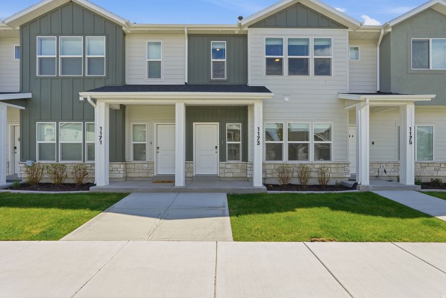 Don't wait for new construction! This barely-lived-in Woodmore Pointe townhome shows like a brand new home. Quartz countertops and LVP flooring throughout give it the clean updated look buyers love. Unlike many townhomes in this price range, this home features a spacious primary bedroom with a walk-in closet and a half-bath on the main level so your guests don't need to go upstairs. Additionally, it's located just minutes from Utah State University and would make a great rental.