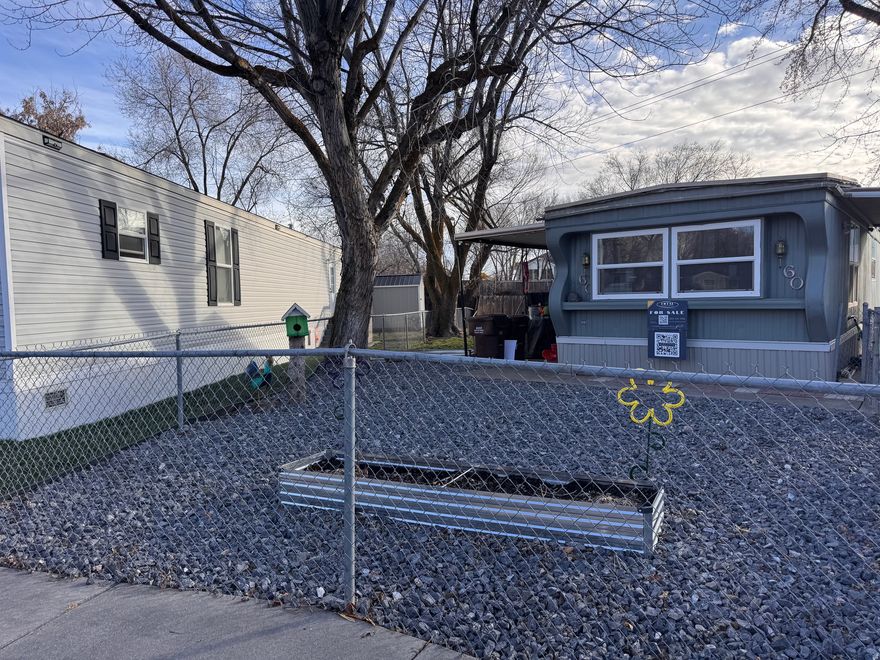 All of the systems have been updated! New rubber roof: 2020, New Windos: 2020, New Subfloor: 2020, Kitchen and bath update: 2021,New plumbing: 2021, New electric panel: 2023, New furnace and central air: 2020, DOUBLE FENCED LOT, Water heater: 2019, Shed, stove, micrwave and washer/dryer convey. Seller willing to leave some furniture items. Buyer must be approved thru the Mobile Home Park before moving in.