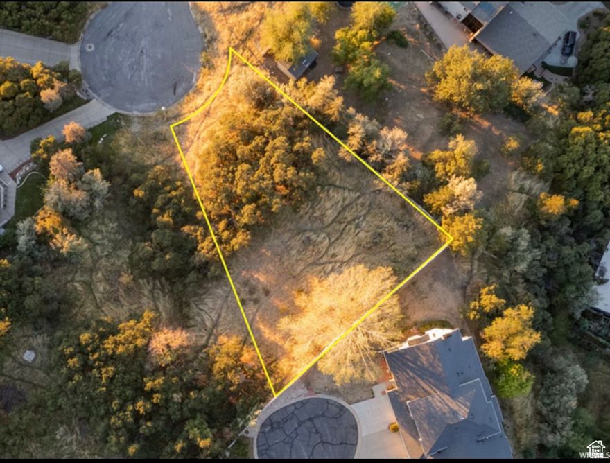 Prime East Bountiful Lot with Stunning Valley Views!  Discover the perfect canvas for your dream home with this exceptional 0.34-acre residential lot nestled in a serene cul-de-sac in East Bountiful. Boasting breathtaking lake, mountain, and valley views, this lot offers a peaceful retreat while still being conveniently located near essential amenities. With no HOA restrictions, you have the freedom to build the home you've always envisioned. The lot is zoned for single-family residential use and is surrounded by beautiful scrub oak for added privacy and natural charm. Don't miss this rare opportunity to secure your slice of East Bountiful's beauty.  Act now and make your vision a reality!