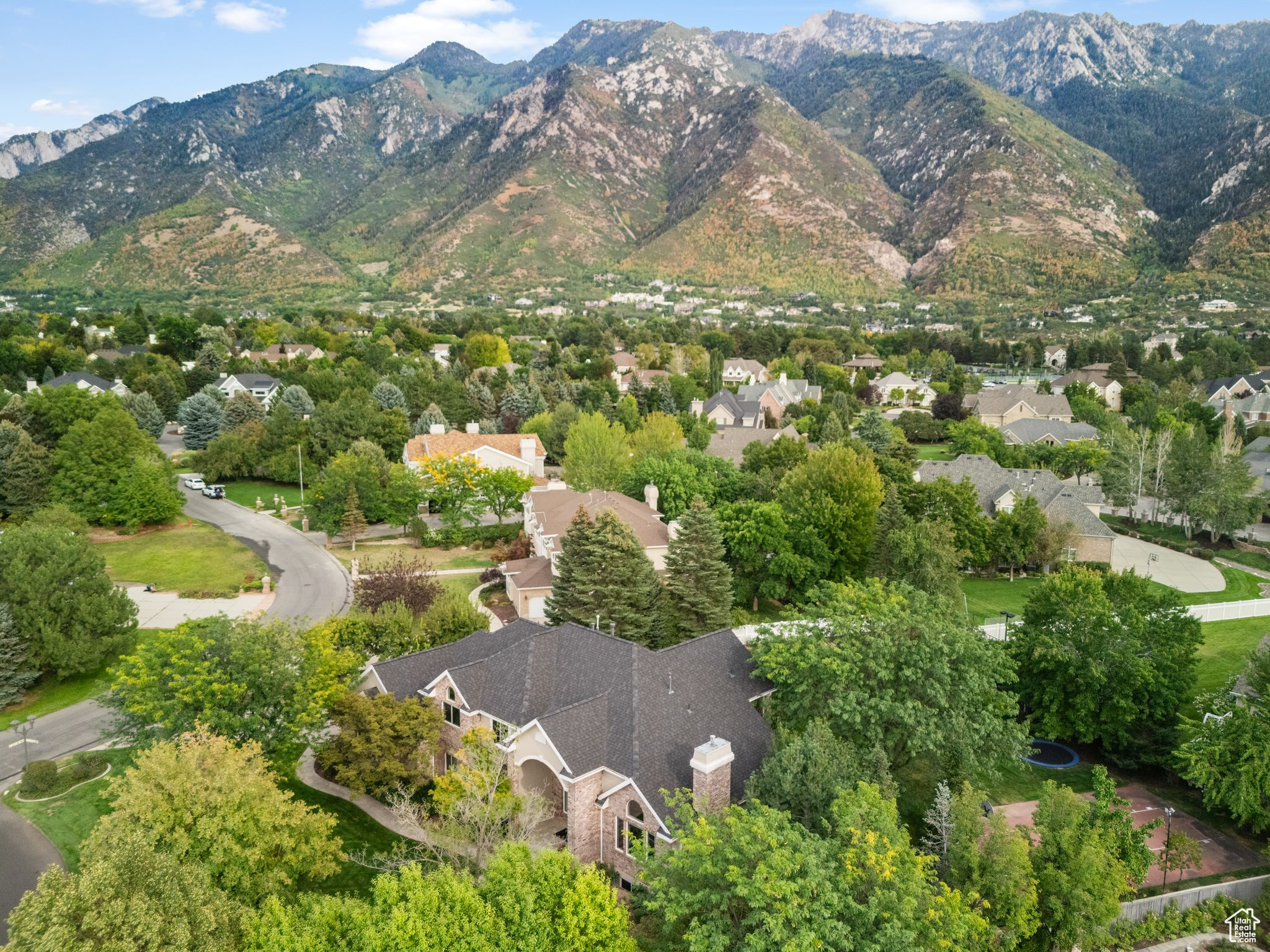 *Multiple Offers received*Welcome to this stunning one owner home located in the exclusive, 24-hour guard-gated,466 acre, Pepperwood community in Sandy, Utah! This .63-acre lot offers a perfect blend of luxury, comfort, and functionality. Designed for modern living, the home features an open-concept floor plan, soaring ceilings, and abundant natural light throughout. The gourmet chef's kitchen boasts high-end appliances, custom cabinetry, and a large island perfect for entertaining. Spacious living areas flow seamlessly to formal and casual dining spaces, while a private office or study provides a quiet retreat for work or reading. The master suite is a true sanctuary, with a large private covered deck to soak in the scenic mountain views, spa-like bathroom, dual vanities, and a walk-in closet. Additional bedrooms are generously sized, perfect for family or guests.The daylight lower level has a Full second kitchen with separate walkout entrance to the garage,2 family rooms and 2 unfinished potential bedrooms with room to add another bathroom. Step outside to your private flat backyard oasis with plenty of space for outdoor living, gardening, recreation, a sport court and in ground trampoline.The property is part of the Pepperwood HOA with a modest monthly fee of $204, ensuring a well-maintained and welcoming community. Location is exceptional-just minutes to World Class Snowbird and Alta Ski Resorts, Hiking & Biking Trails,Salt Lake City International Airport, and a variety of shopping, dining, and entertainment options. This home combines luxury, convenience, and lifestyle, making it ideal for families, professionals, or anyone who loves to entertain. Don't miss your chance to own one of Sandy's most sought-after properties! Buyer to verify all information.