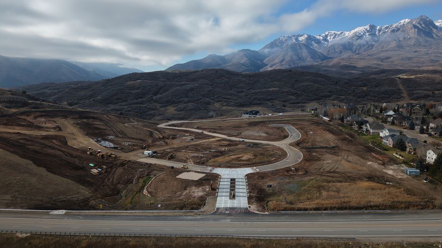 Buy a Lot, Bring a Builder, or Build with Us. Lot 122 at The Range in Mountain Green is a 0.50-acre estate lot, offering one of the most affordable ways to own in this luxury mountain community. Surrounded by the Wasatch Range and located just minutes from Snowbasin Resort and Pineview Reservoir, this homesite blends mountain seclusion with easy access to year-round recreation and a quick commute to Salt Lake City. Work with Cole West's design team to select from four professionally curated home plans, design a fully custom residence, or bring your own builder to create a home that reflects your lifestyle. With utilities stubbed to the lot and HOA care for open space landscaping, and snow removal, building here is as seamless as it is inspiring.