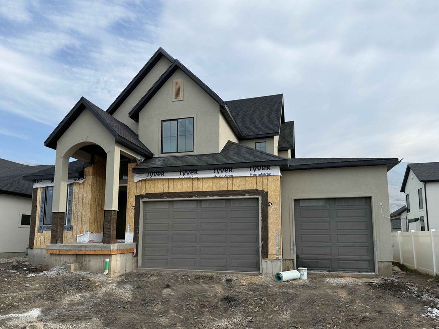 Lot 108 in Summerhill Lane by Symphony Homes. This Libby plan is in a prime location close to everything. Estimated completion is March 2026. Discover the difference in quality from this trusted local builder of semi-custom homes. This spacious two-story offers thoughtful design, high-end finishes, and unique features throughout. The true three-car garage provides ample parking and storage. The main level features a large galley-style kitchen with a walk-in pantry, 36" gas cooktop range, double ovens, a bright dining nook. Just off the entry, a flex room with a stunning custom feature wall adds character and versatility. The family room boasts a soaring two-story ceiling and a beautiful fireplace, creating a warm and inviting space for gathering and entertaining. The main floor also includes the primary suite, complete with an ensuite bath, walk-in closet, and a nearby stackable laundry closet for added convenience. Upstairs, you'll find a generous loft that overlooks the family room below, two additional bedrooms-each with walk-in closets-and a large laundry room. The finished basement includes a spacious family or game room, two more bedrooms and a bath. Plus, it's stubbed for a future wet bar if you wish to add it, and has plenty of storage. A covered patio extends your living space outdoors, and the home is equipped with an active radon system and secondary water stubbed to the lot.