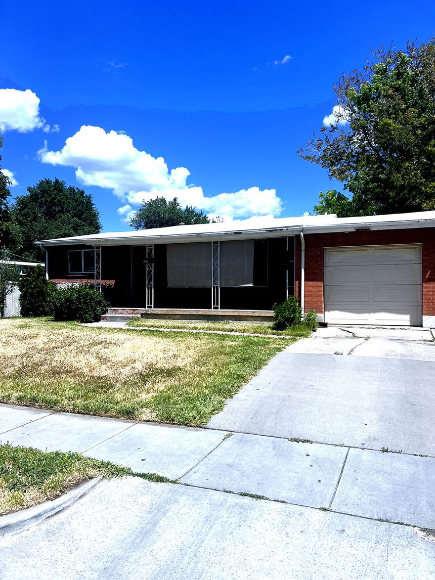 A 1954 single-story rambler in Salt Lake City's established Glendale neighborhood. Original galvanized plumbing has been fully replaced and the HVAC has been updated. 1,696 sqft of comfortable living, 3 bedrooms (2 finished), 1 bathroom, and a partial basement with room to grow. Set on a generous 0.26-acre lot with the preferred east-facing backyard. Quick access to downtown, I-15, and the airport. Occupied, call/text for showing details.