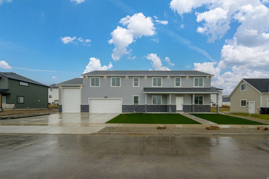 Experience the ultimate retreat every single day. This isn't just a residence; it's a sprawling 4,000-square-foot sanctuary where high-end utility meets master-class craftsmanship. From the soaring architectural lines to the bespoke climate control, every detail has been curated to provide a five-star living experience.  For the collector and the adventurer, the home features a massive 6-car garage. Designed with a sophisticated pass-through for seamless transitions and a 14-foot dedicated RV portal, your entire fleet is housed in a space as polished as the rest of the estate.  Step inside to find a sense of boundless scale. The main level welcomes you with 9-foot ceilings, while the upper story ascends into dramatic vaulted peaks, creating an airy, light-filled atmosphere. The entire 4,000-square-foot floor plan is fully finished, ensuring that every inch of your home feels intentional and welcoming.  The chef's kitchen serves as the heart of the home, fully equipped with a suite of high-grade appliances, including a high-capacity refrigerator. The centerpiece is the specialized baker's wall oven, designed for those who view cooking as an art form.  With 6 expansive bedrooms and 4 designer bathrooms, there is an abundance of space for family and guests to enjoy total privacy. Each room is illuminated by custom-integrated can lighting, casting a warm, sophisticated glow throughout the home.