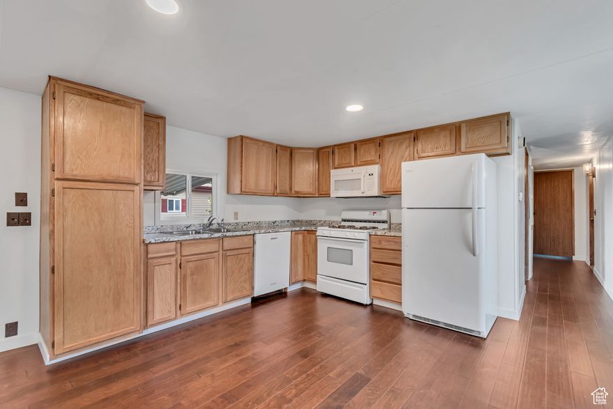 Charming 3-bed, 2-bath home in highly desired Winchester Estates 55+ community. New flooring, new paint, updated kitchen, new deck, new windows, washer and dryer. Two large sheds, spacious kitchen, open living area, large front deck, and private yard with mature trees. Amenities include clubhouse, RV/boat storage, sidewalks, and mountain views. Located near Freeway, Murray Parkway Golf Course, Topgolf, shopping, dining, and minutes to SLC. Lot rent $1,075/month plus w, s, t.  Park approval required.
