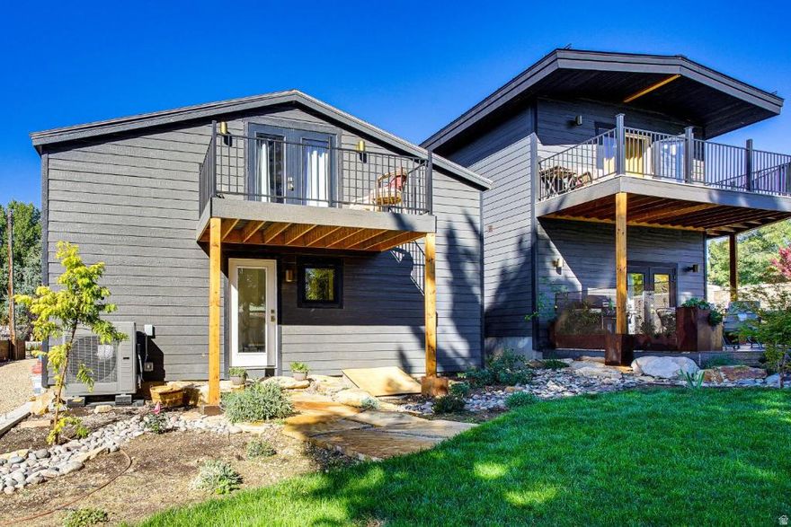 Main House Features:  Bedrooms: 3 Spacious bedrooms Bathroom: 2 full baths Detached garage with ADU and Flex space.  custom tile work and Large walk -in showers.  Living Space:  Great Room: Open 2 living room, dining area and large kitchen.  Kitchen: Updated with modern appliances ample storage.  Outdoor Space: Five beautiful Decks One deck accessible  from dinning room via French doors.  Investment Potential: Located within walking distance to: Restaurants Grocery stores Coffee shops Midway ice skating rink  Investment opportunities:  combining a two car garage with two distinct living areas above and behind it, perfect for guests or rental purposes. Two-car Capacity: two vehicles with EV charging station.  Access: Convenient entry points to both the apartment above and the office/bedroom Great for rental income or accommodating extended family unique property with versatile living arrangements  This property presents a rare opportunity for potential homeowners or investors looking for a multi-functional residence . With its spacious layout, modern updates, and ideal location, its a perfect fit for families or those seeking rental income.