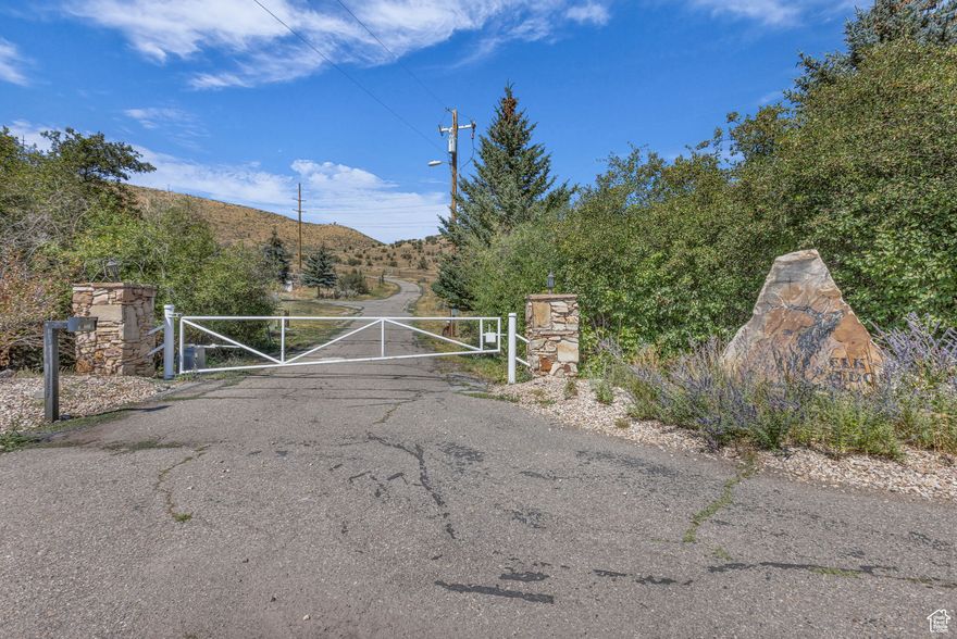Discover 19.9 acres of pristine mountain living in the private, gated enclave of Elk Ridge Estates. This rare homesite offers unmatched privacy and exclusivity within a five-lot community, showcasing spectacular down valley views of Peoa, the Uinta Mountains, and the Weber River. The property also features approximately 300 feet of seasonal creek frontage, adding to its natural beauty and appeal. With year-round paved road access, power at the lot line, and a dedicated water share for ponds or landscaping, the property is uniquely well-equipped for acreage of its size. Zoned for residential acreage, the lot is ideal for building your dream single-family residence, with ample room for outbuildings or equestrian facilities. Water share is included in the low-cost HOA fee each month. The setting allows for a wide range of recreational or hobby uses, creating an exceptional opportunity to design a true legacy estate. Conveniently located just 8 miles east of downtown Park City, 12 miles to Deer Valley's new East Village, and 16 miles to Canyons Village at Park City Mountain Resort, the property balances privacy with easy access to world-class skiing, dining, and entertainment. Outdoor adventure is endless with Rockport and Jordanelle State Parks in close proximity for fishing, boating, and hiking, and the Uinta Mountains nearby for snowmobiling and year-round exploration. With its soaring views, functional utilities, and rare combination of privacy and access, this 19.90-acre parcel is more than just a homesite; it's a true mountain sanctuary with unlimited potential.