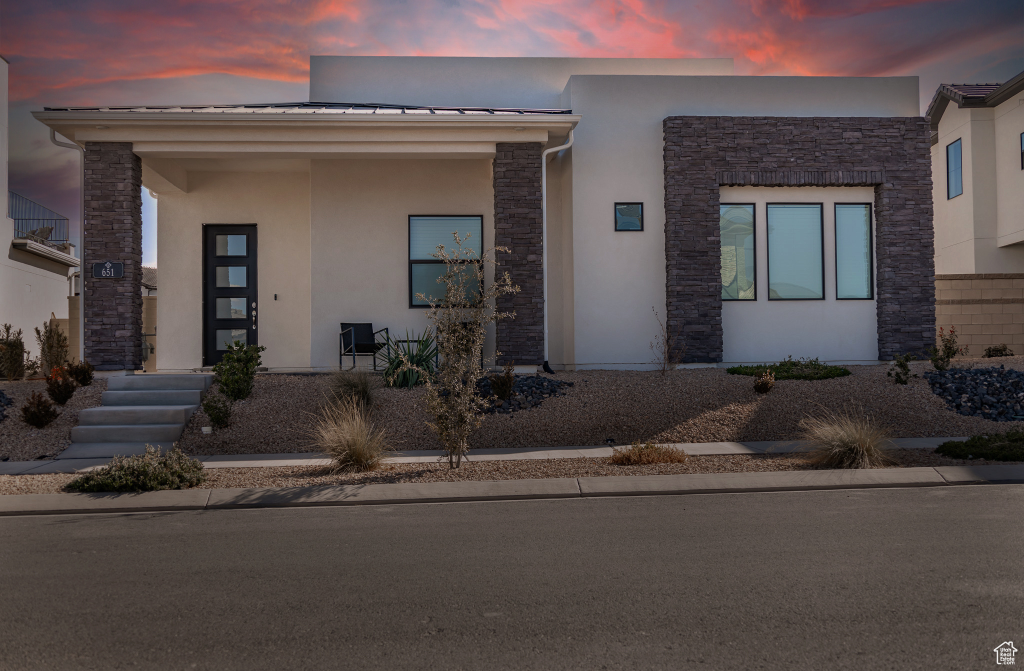 Modern design meets comfort in this stylish home on a premium lot in Desert Color's Sage Haven. The open layout features bright, airy spaces, a kitchen with stainless steel appliances, quartz countertops, and a large pantry. The primary suite has dual walk-in closets and a spacious shower, with two more bedrooms offering walk-in closets. Upgrades include a built-in sound system (living room, primary, patio), water softener, epoxy garage floor with overhead storage, and soft-close cabinets. Low-maintenance desert landscaping adds to the appeal. Enjoy parks, trails, a prep academy, seasonal events, a 10-foot-deep lagoon, and a year-round heated pool and jacuzzi. Close to Big Shots, SGU Airport, and future shops, dining, and more.