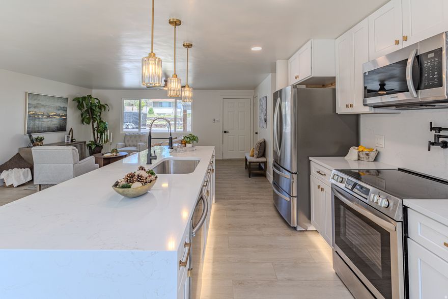 Beautifully renovated 6-bedroom, 2-bath home featuring a fully separate basement ADU with its own private entrance, kitchen, washer/dryer, and living space.   The stunning main kitchen features an oversized island, elegant waterfall countertops, LED lighting, and upscale touches like a pot filler over the range. Bright, open living areas and stylish finishes create a clean, modern feel throughout the home. Each level features 3 bedrooms, washer/dryer hookups, updated kitchen, and updated bathroom - giving both the main level and basement a clean, modern feel.   Outside, enjoy a large fully fenced yard with brand-new sod and plenty of room for entertaining. Conveniently located near shopping, schools, parks, and commuter access, this turnkey property offers flexibility, value, and modern upgrades all in one.  Square footage figures are provided as a courtesy estimate only and were obtained from county records.  Buyer is advised to obtain an independent measurement.