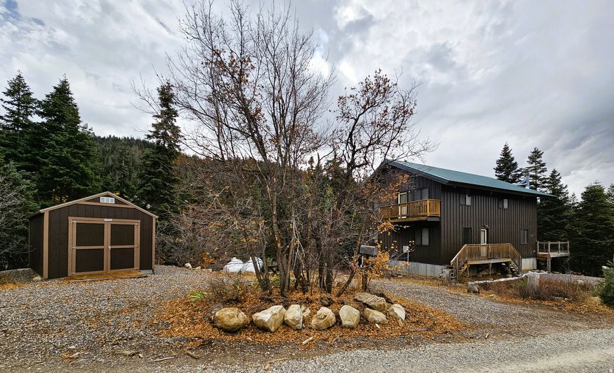 Your mountain escape is waiting - a home away from home tucked among mature trees serenaded by a flowing creek. The cabin is fully furnished and delivers instant relaxation and unforgettable views. This well lit open-concept cabin provides seamless indoor-outdoor living with multiple balconies and an expansive deck.  Plenty of fresh mountain air, wonderful views, sounds of nature and creekside ambiance is offered to you. Everything will work together to deliver experiences for creating memories. **Potential income by offering short term rental, when you're not using the cabin. The unfinished basement-with ground-level double doors-is perfect for ATV storage or future expansion. **Propane back-up Generator included, new in box. Enjoy peaceful, low-traffic surroundings on a quiet dead-end road, or walk down to the creek for an extra adventure. Engineered for longevity, this cabin features a low-maintenance exterior and a brand-new roof, providing you with lasting peace of mind. Enjoy nearby Manti-La Sal National Forest and Skyline Drive, including 600+ miles of the Arapeen ATV/OHV trail. Year-round recreation: hiking, mountain biking, ATV/side-by-side exploring, fishing, hunting, water sports, rock climbing, cross-country skiing, snowshoeing, tubing/sledding or snowmobiling. Minutes to Mt. Pleasant, Spring City, and Fairview with amenities such as an indoor rec pool, grocery and hardware stores, a hospital, arts, activities, restaurants and a drive-in theater. Winter access is by tracked vehicles only. Elevation is 7,235. Google Maps is 39.48999, -111.39195. Buyer to verify all information.