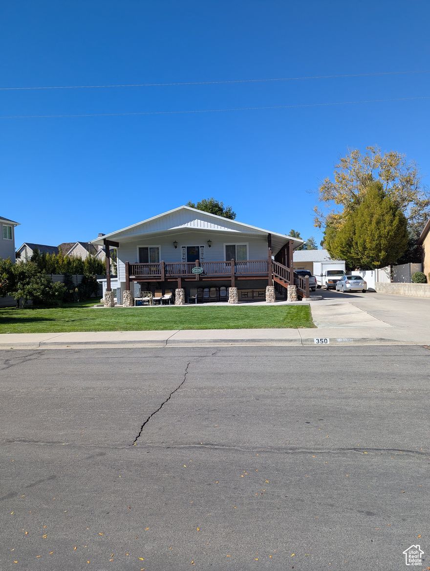 A wonderful updated & remolded, open home with a room accessory apt. All windows are double pane prime vinyl.  All plumbing, & electrical systems have been redone & updated before 2016. The entire home runs on solar with a backup battery. (meaning no electrical charges & no down time due to storms etc. About a $50,000+ upgrade. ) There are 3 furnaces with 'soft start'. 2 attic fans, 2 basement entrances, 2 microwaves, 2 ranges, & 2 washers & dryers.  One fridge stays ( the one in the apt.) with the house.  The upstairs has A/C which runs off the solar.  The accessory apt is plumed for a/c, to be added, but has remained cool & comfortable throughout the summers for its occupants.  There is a massive amount of storage area with an open family friendly flow through the home.  The down stairs apt has no stairs, wheelchair friendly with a roll in shower.  Buyers and Buyers rep to verify all information.  Pricing & sq. footage are based off a recent appraisal.