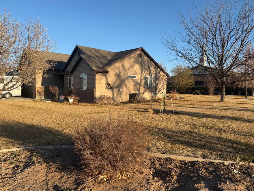 Enjoy single-level living in this beautiful home. The Vaulted living area opens onto the dining room and kitchen. There is also a large bonus room upstairs. Appreciate the large corner lot with abundant lawn & landscaping. Trees, shrubs, and flowers abound around the large lawn, which is all auto-watered. There is a garage for the cars and a shed for the lawn & garden equipment. You will also find a large cemented storage area in the crawl space and a newer, efficient tankless gas water heater.