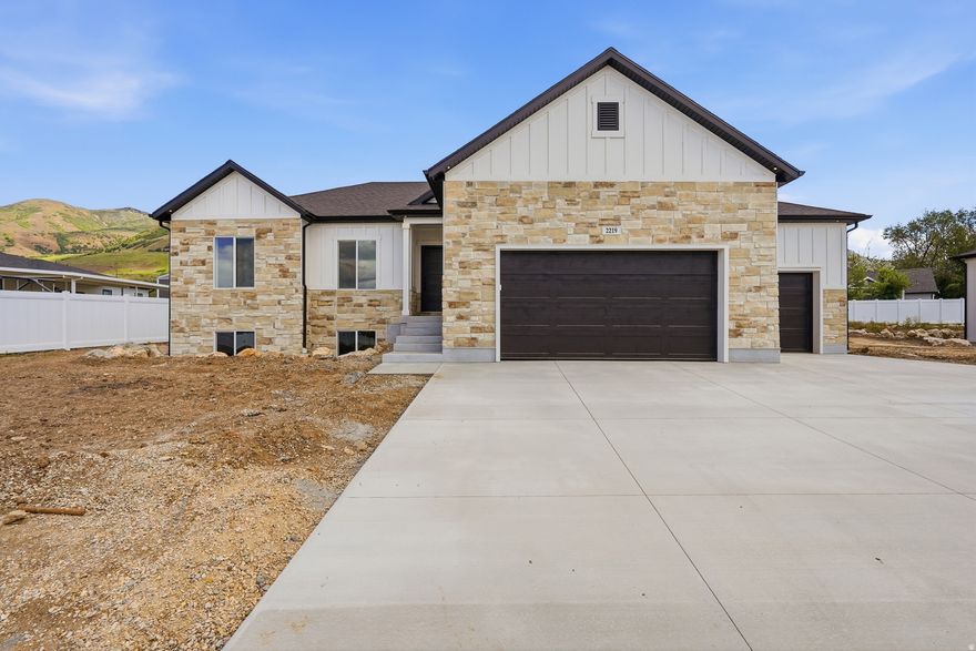 Located on the beautiful east bench of Perry with stunning mountain and valley views, this modern transitional rambler offers exceptional craftsmanship and today's most sought-after finishes. Built by a builder known for high-end quality, this home features 3,200 total square feet with 1,600 square feet on the main level and an unfinished walk-out basement ready for future expansion, all situated on a spacious -acre lot. The exterior showcases a beautiful blend of stone, Hardie siding, and stucco, while the interior features vaulted ceilings, custom hardwood flooring, designer tile, accent walls, and upscale lighting throughout. The gourmet kitchen includes Bosch appliances, a cooktop with custom hood, a large island, Level 6 quartz countertops with thick mitered edges, and a spacious pantry with custom shelving. The luxurious primary suite offers alder ceiling beams, a large custom closet, soaker tub, and a custom shower with Euro glass door. Additional highlights include a 3-car insulated garage with upgraded MyQ wireless garage doors, covered patio, iron stair railing, 5-foot linear fireplace, tankless water heater with recirculator, 96% efficiency furnace, and 30-year shingles. Seller is offering a $10,000 incentive toward buyer closing costs, subject to lender requirements.