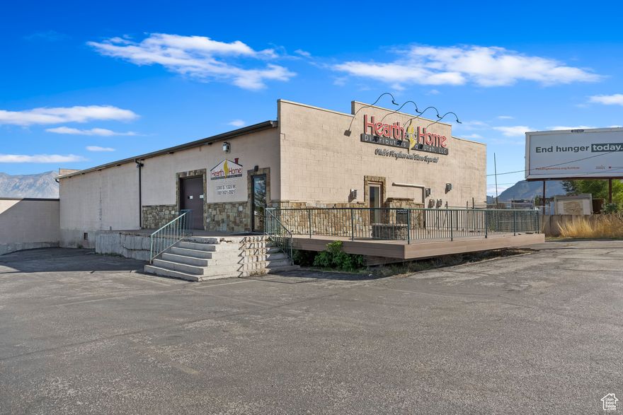 Offering a substantial 14,000 sq ft of versatile space, this commercial property is positioned on a 0.61-acre site within the Ogden City M-1 zone. The property features a welcoming front showroom complemented by multiple office spaces, large open warehouse areas, two dock-high overhead doors, and one drive-in door, catering to a variety of business operations. Added security is provided by a fenced storage yard. Located strategically with frontage on both Hinckley Drive and 1325 South, it offers direct access to freeways and critical roads. Situated in an Ogden City HUBZone, near the Ogden Industrial Park and Ogden-Hinckley Regional Airport, surrounded by a mix of local, regional, and national commercial and industrial enterprises, this property an exceptional opportunity for businesses aiming for growth and visibility. Tenant improvements negotiable.