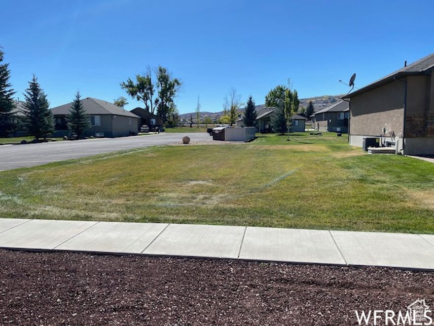BEAR LAKE BUILDING LOT--- FLAT, Located in private and quiet community of The Cottages with paved roads Borders huge common area and overflow parking, paved walking/bike path runs right by The Cottages, WALK TO THE BEACH. All utilities are stubbed. Across from Pickleville Playhouse, minutes to Bear Lake Golf Course, downtown Garden City and Bear Lake State Park Marina.  Hodges Canyon Trailhead is just to the NW for ATV/UTV, snowmobiling, hiking. Beaver Mountain Ski Resort 20 minutes.