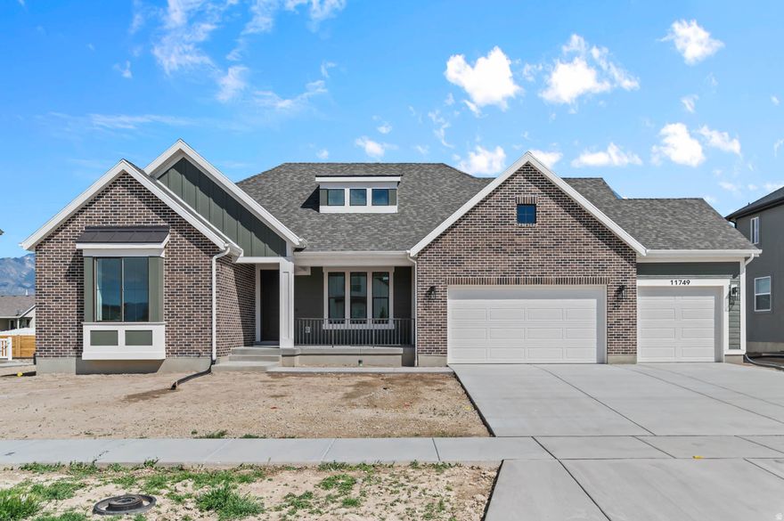 The Carlisle Traditional combines timeless elegance with modern comfort in a great community! The gourmet kitchen features Bluff Maple cabinets with LED lighting, complemented by sleek Quartz countertops and Stainless Steel Cafe Gas appliances, including double ovens for the ultimate cooking experience. Beautiful laminate hardwood flooring flows throughout the main living areas, with tile in wet spaces and soft carpet in the bedrooms. The open and inviting Great Room is centered around a Gas Log Fireplace, providing the perfect place to unwind. Thoughtful touches throughout the home include can lighting, Christmas light package, and black matte hardware. The home also features 9-foot foundation basement walls, a spacious 3-car garage with an exit door, and a large expanded deck perfect for entertaining. The tile surrounds in bathrooms, textured walls, and two-tone paint add sophistication, while the Roosevelt base and casing enhance the home's classic charm. Additional features include gas lines to the dryer and BBQ and a radon ventilation passive system, making this home as functional as it is beautiful.